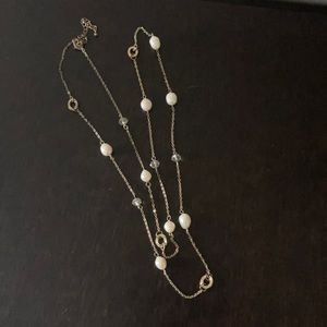 Long gold necklace with crystals and faux pearls